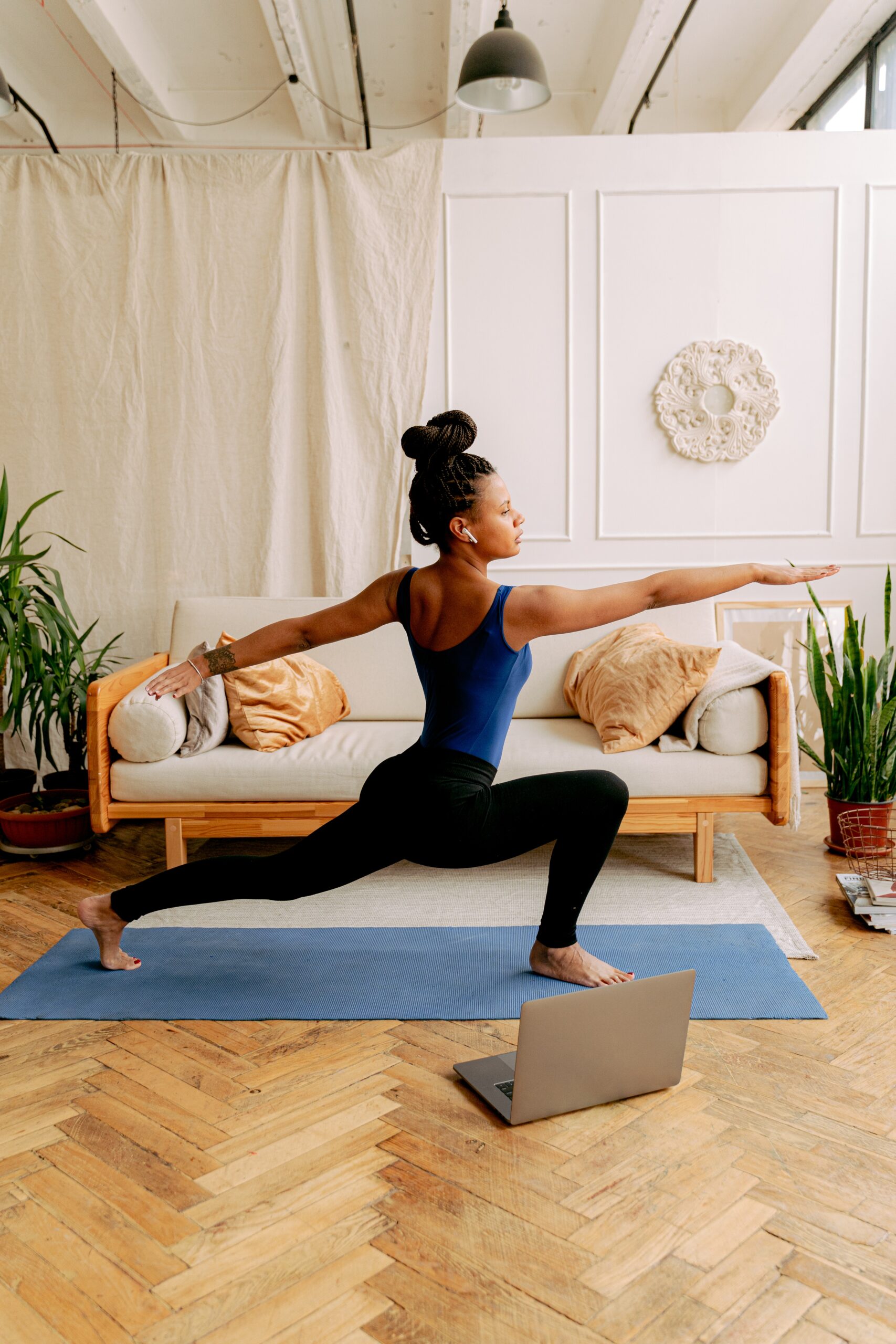 Woman practices yoga at home